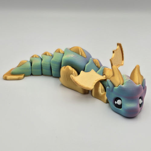 Articulated Baby Dragon – Rainbow & Gold  design by Layers In Green